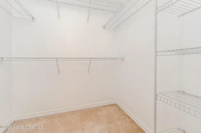 a view of an empty walk in closet