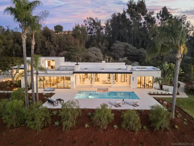 a view of a swimming pool with a yard