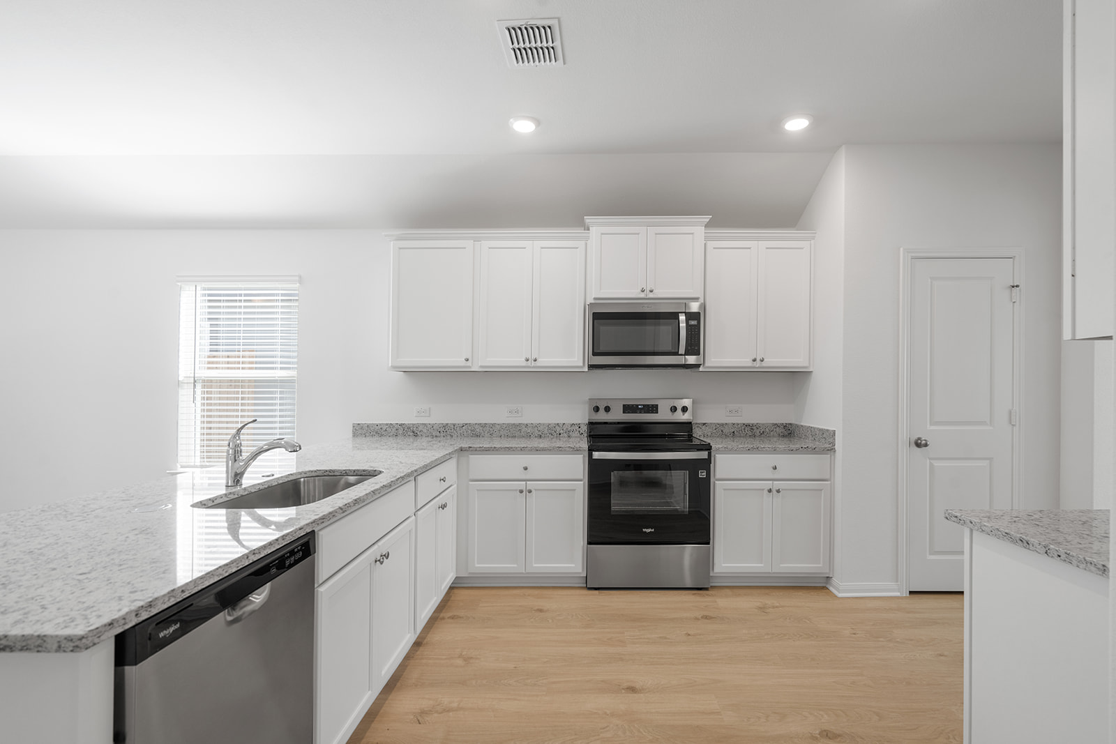 Undisclosed Address Jarrell, TX 76537 - Photo 4 of 7 a large kitchen with cabinets stainless steel appliances and a sink