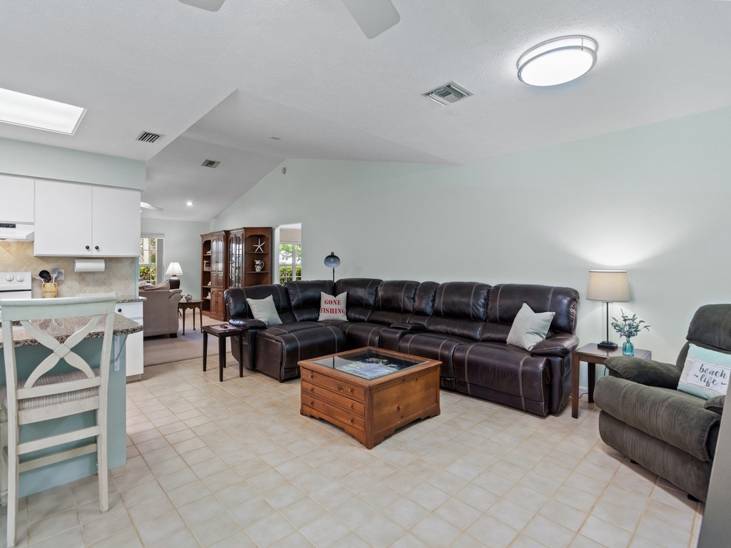 765 Date Palm Road Vero Beach, FL 32963 - Photo 11 of 36 a living room with furniture and a table