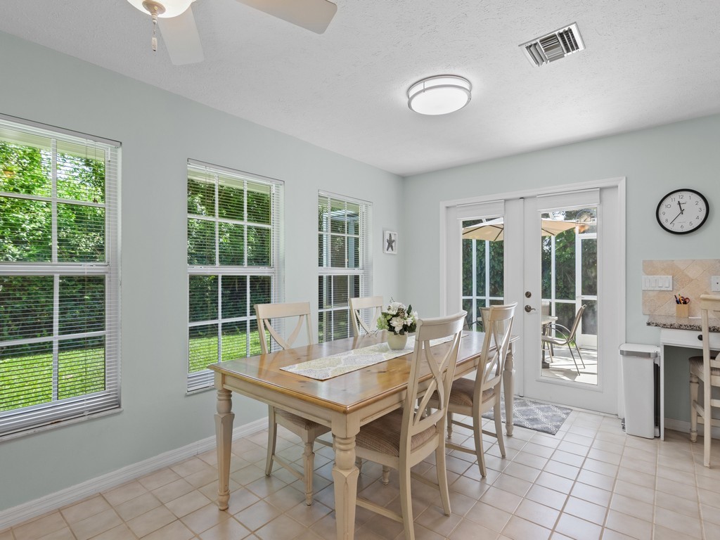 765 Date Palm Road Vero Beach, FL 32963 - Photo 14 of 36 a view of a dining room with furniture and window
