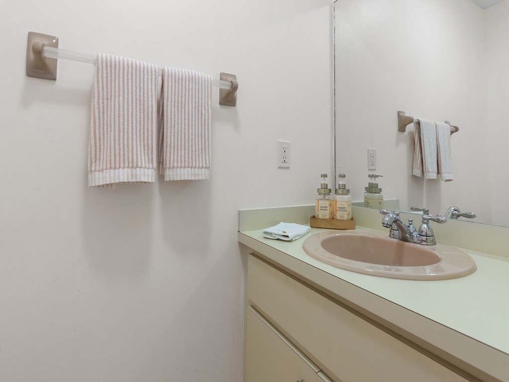 765 Date Palm Road Vero Beach, FL 32963 - Photo 16 of 36 a bathroom with a sink and a mirror