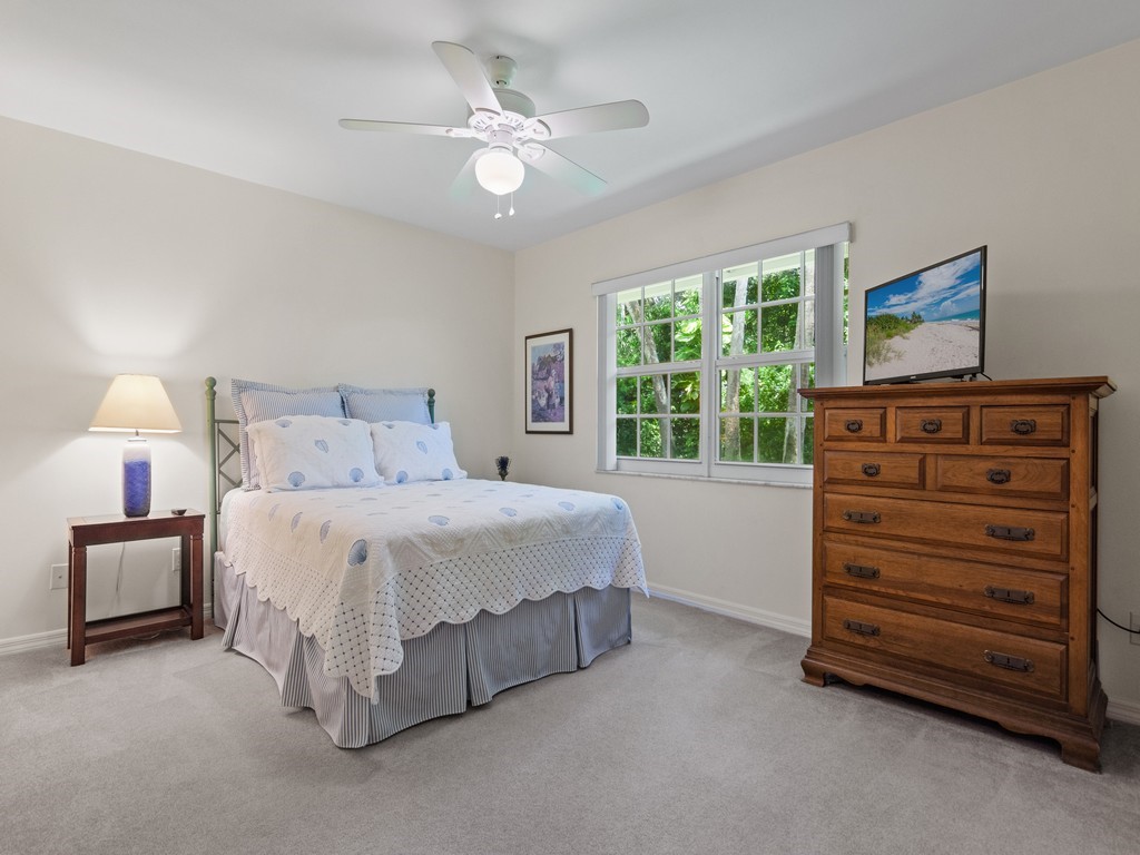 765 Date Palm Road Vero Beach, FL 32963 - Photo 20 of 36 a bedroom with a bed and a window