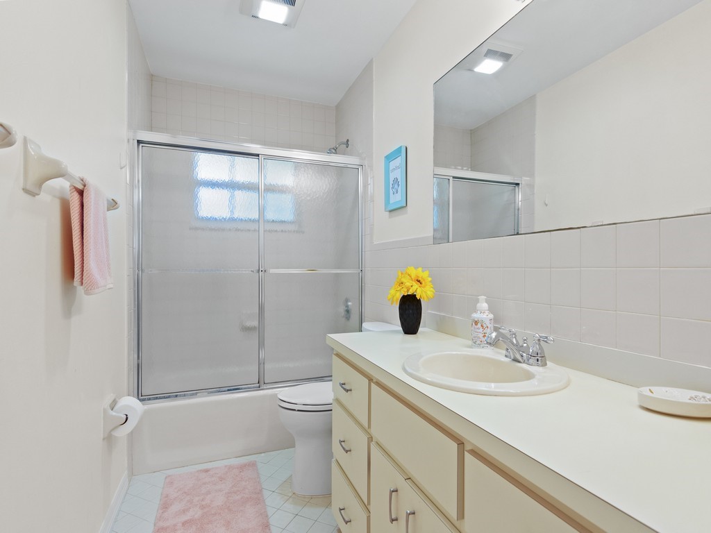 765 Date Palm Road Vero Beach, FL 32963 - Photo 22 of 36 a bathroom with a sink toilet and shower