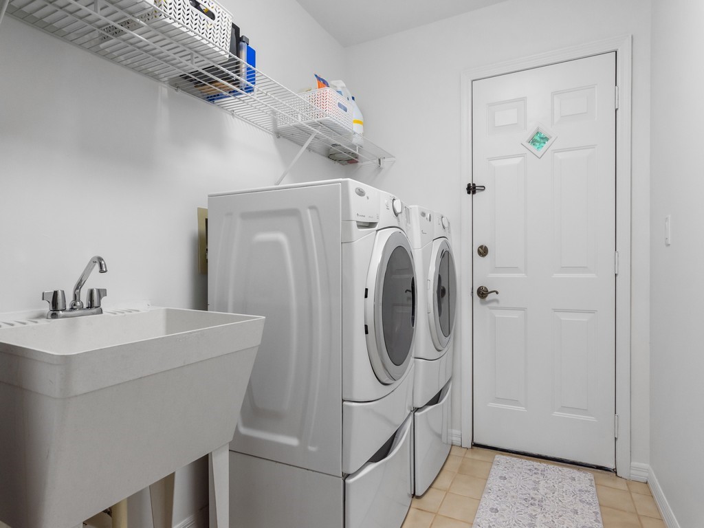 765 Date Palm Road Vero Beach, FL 32963 - Photo 23 of 36 a utility room with dryer and washer