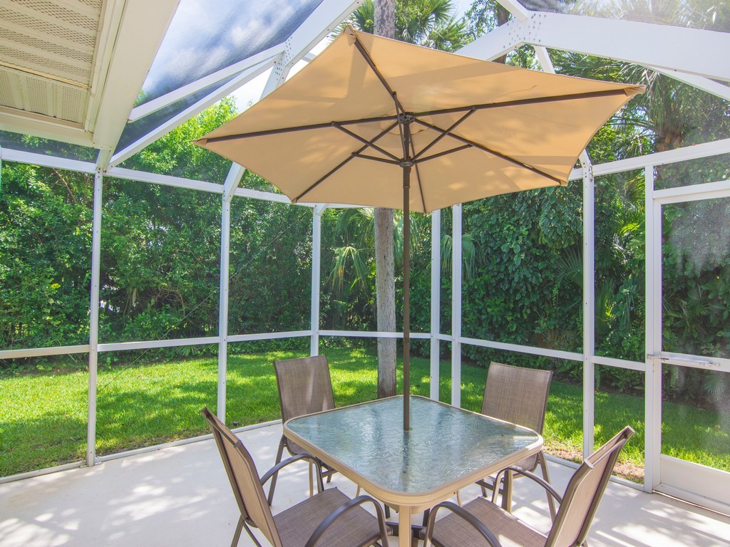 765 Date Palm Road Vero Beach, FL 32963 - Photo 25 of 36 a view of a chair and table in the patio