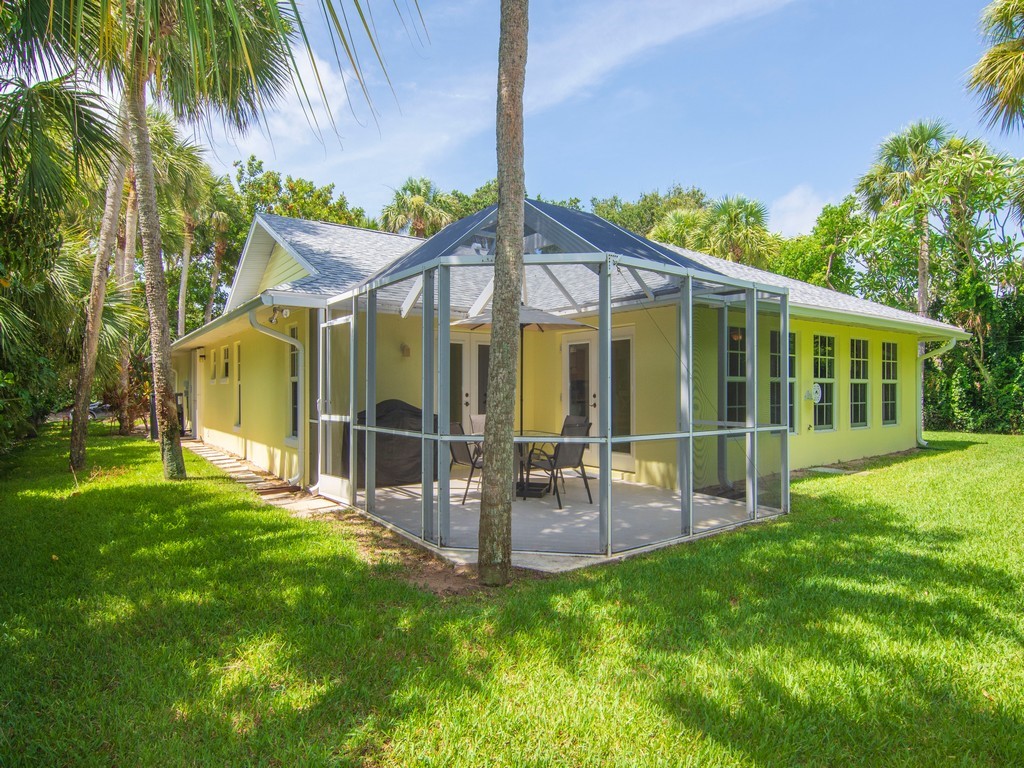 765 Date Palm Road Vero Beach, FL 32963 - Photo 27 of 36 a view of a house with a yard and sitting area