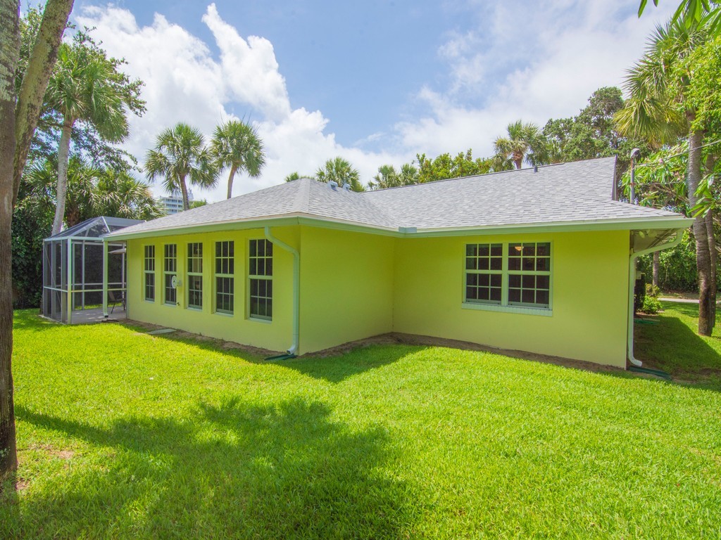 765 Date Palm Road Vero Beach, FL 32963 - Photo 28 of 36 a view of an house with backyard space and balcony