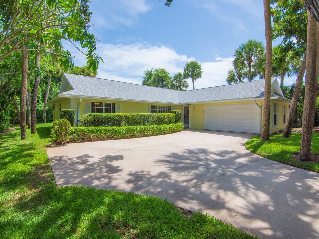 765 Date Palm Road Vero Beach, FL 32963 - Photo 29 of 36 a view of a backyard with a garden