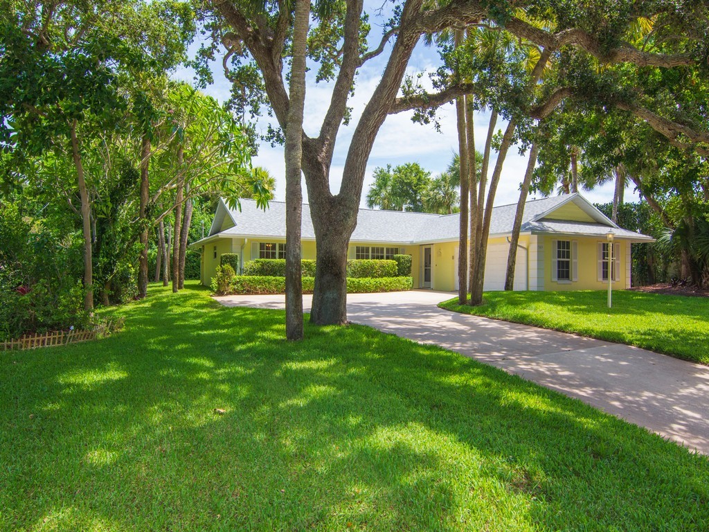 765 Date Palm Road Vero Beach, FL 32963 - Photo 30 of 36 a view of house with a garden