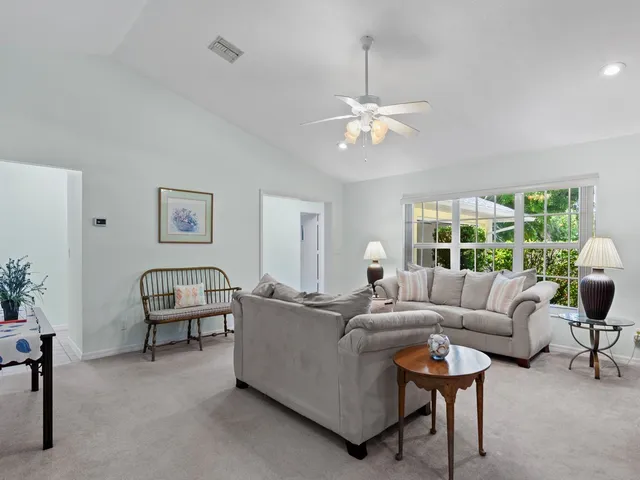 a living room with furniture and a table