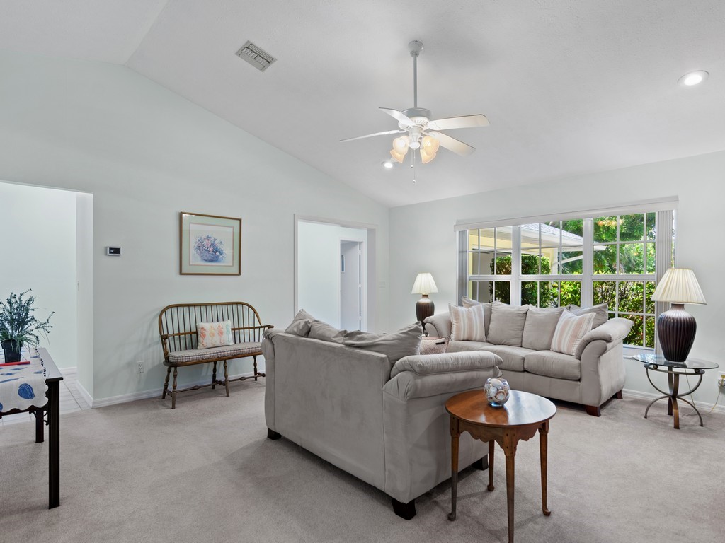 765 Date Palm Road Vero Beach, FL 32963 - Photo 5 of 36 a living room with furniture and a large window