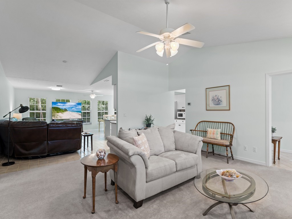 765 Date Palm Road Vero Beach, FL 32963 - Photo 6 of 36 a living room with furniture and a table