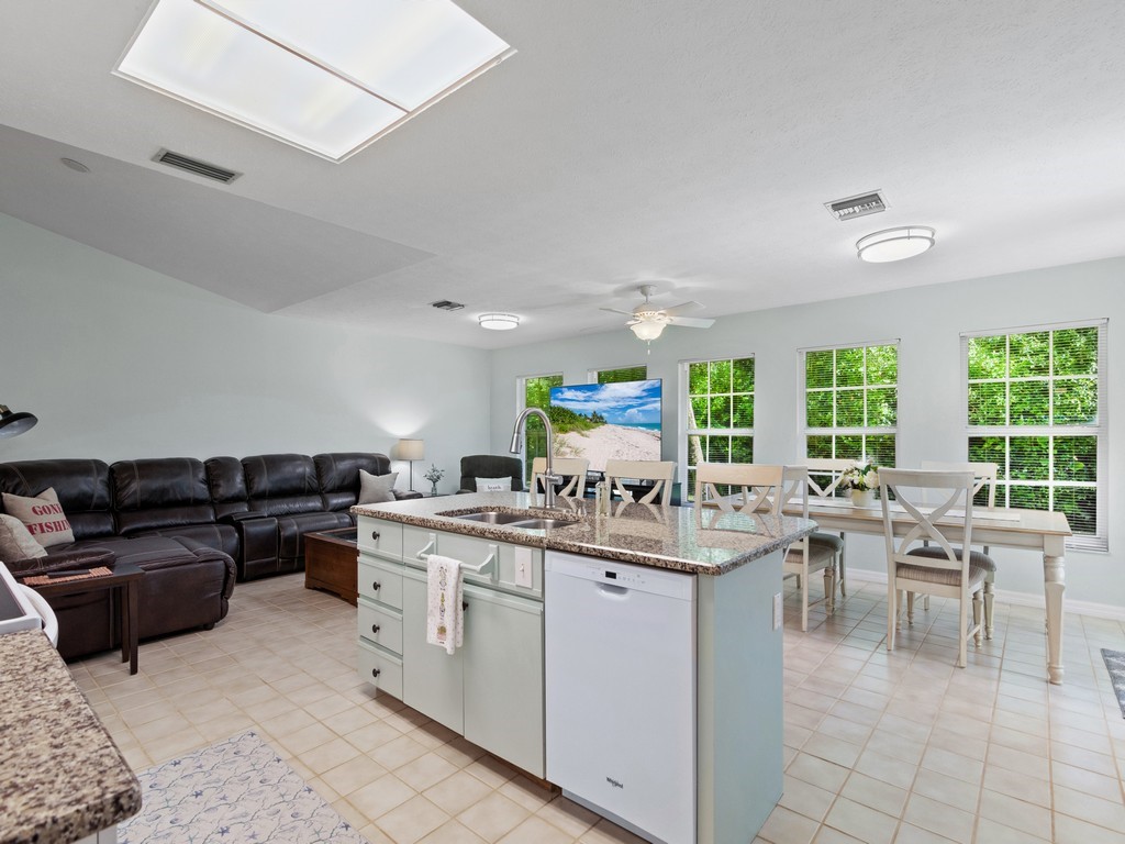 765 Date Palm Road Vero Beach, FL 32963 - Photo 9 of 36 a kitchen with a stove a sink and a refrigerator