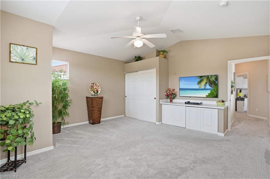 10871 Crooked River Road, Unit 202 Estero, FL 34135 - Photo 29 of 46 a view of a kitchen with kitchen island and stainless steel appliances