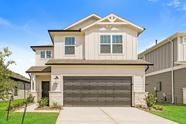 front view of a house with a yard