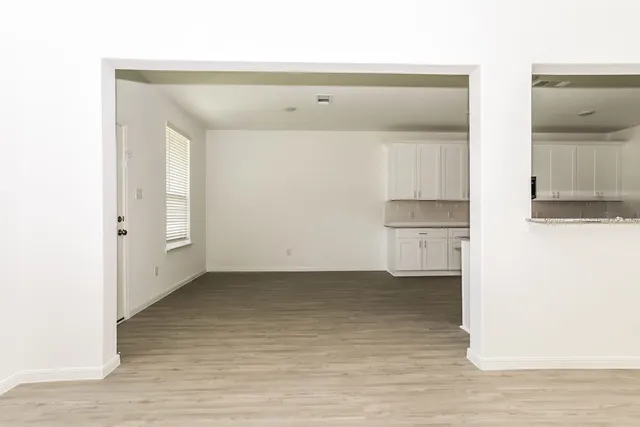 a kitchen with a refrigerator sink and stove