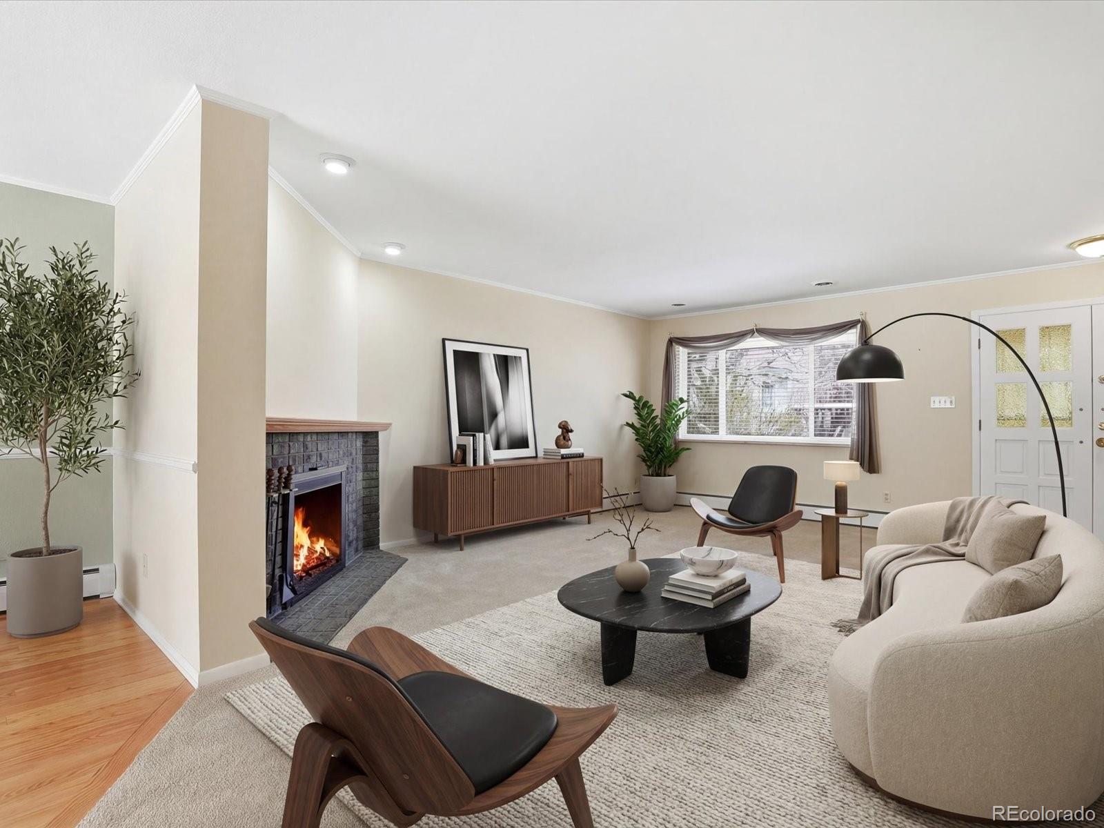 3330 South Oneida Way Denver, CO 80224 - Photo 2 of 36 a living room with furniture fireplace and a potted plant