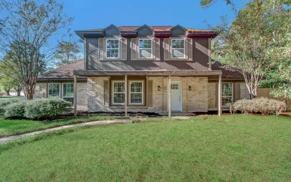 front view of a house with a yard