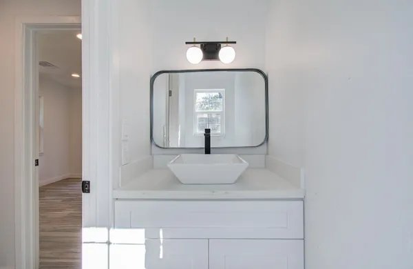 a bathroom with a sink and a mirror