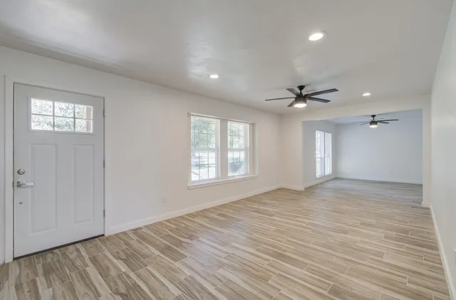 a view of an empty room with a window