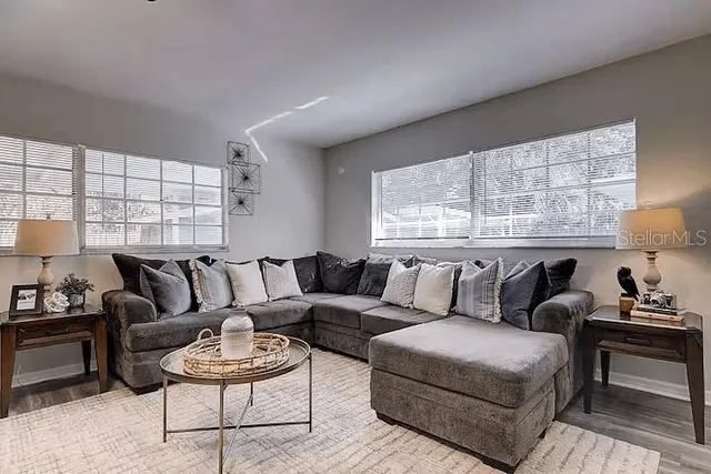a living room with furniture and a large window