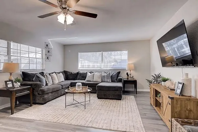 a living room with furniture and a flat screen tv