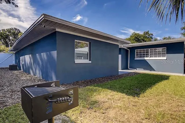 a view of backyard of a house