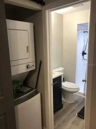 a bathroom with a toilet and a shower