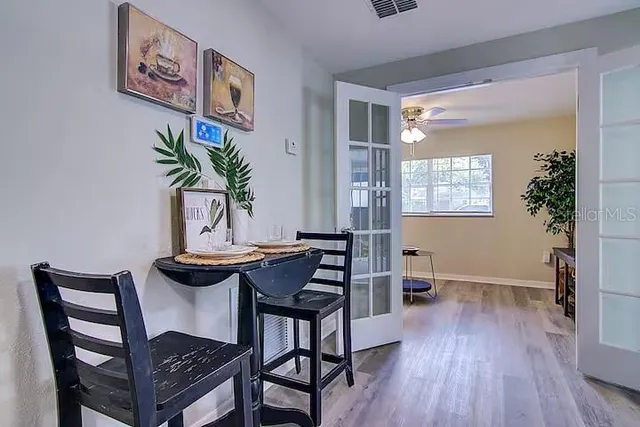 a view of a dining room with furniture and wooden floor