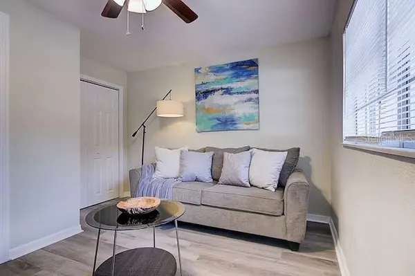 a living room with furniture and a window