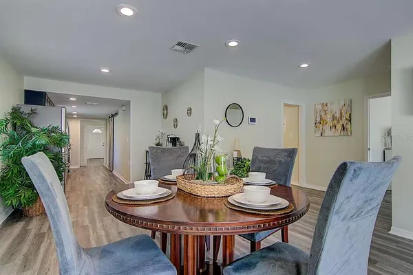 a view of a dining room with furniture window and wooden floor