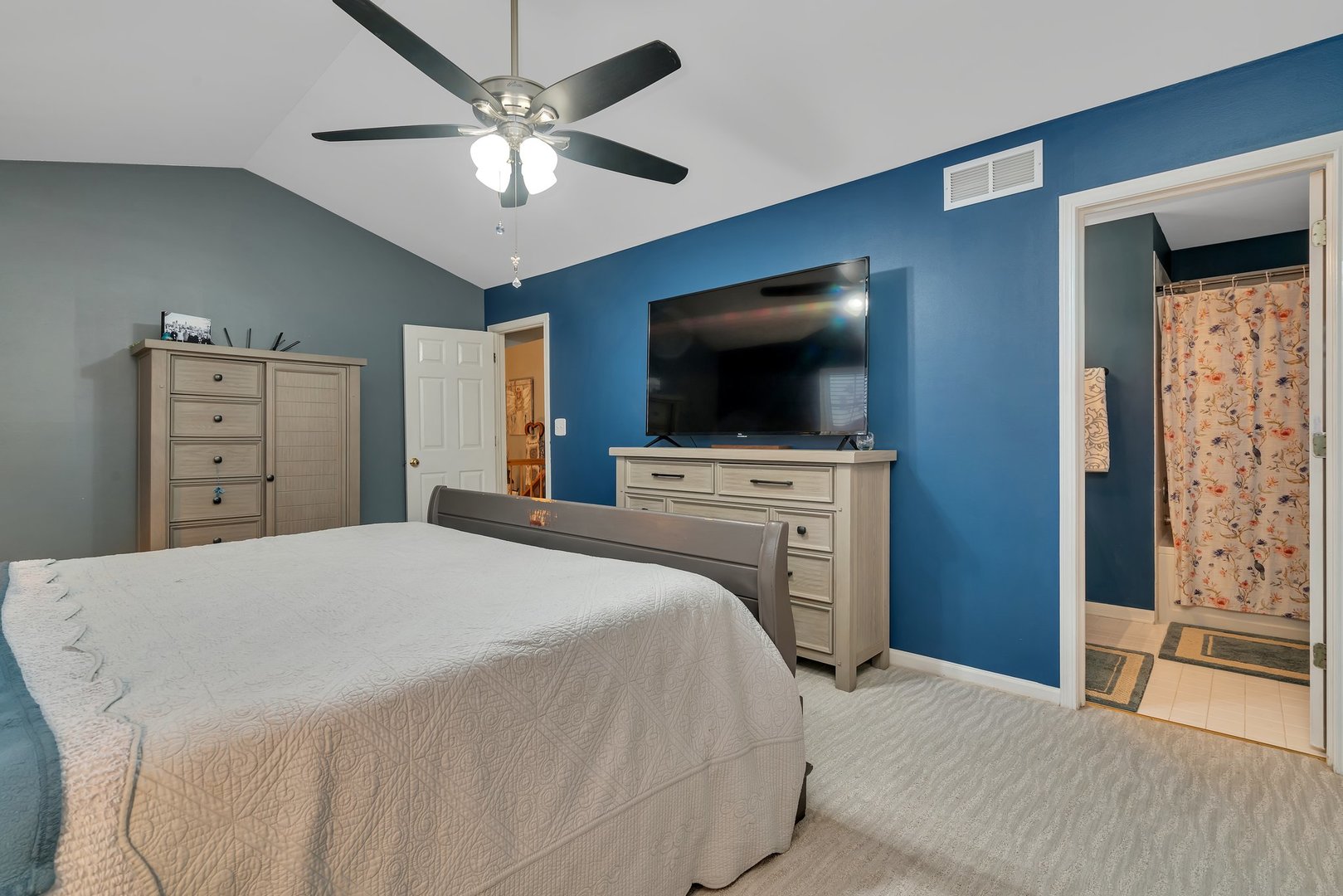 7312 Atkinson Circle Plainfield, IL 60586 - Photo 15 of 27 a bedroom with a bed and a flat screen tv