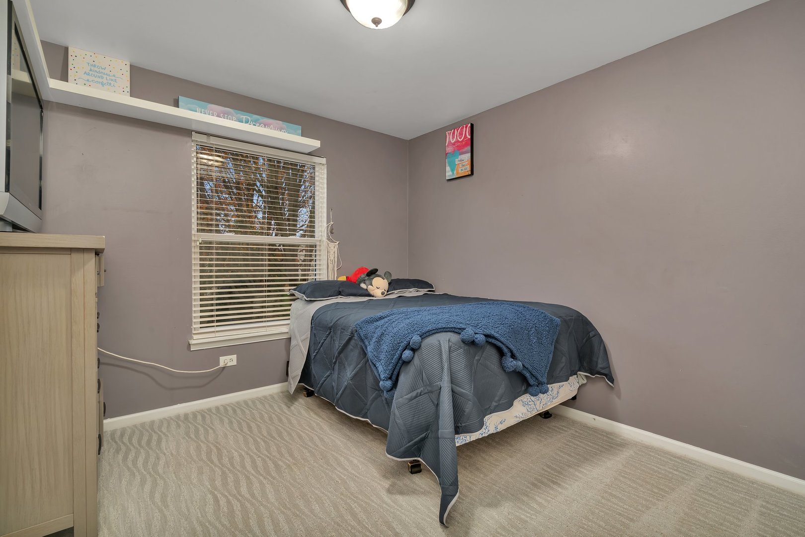 7312 Atkinson Circle Plainfield, IL 60586 - Photo 17 of 27 a bedroom with a bed and window