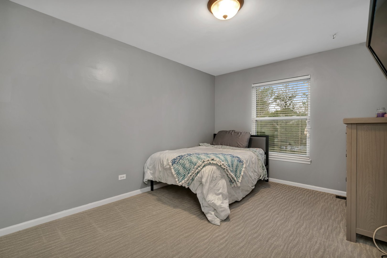 7312 Atkinson Circle Plainfield, IL 60586 - Photo 19 of 27 a bedroom with a bed and a window