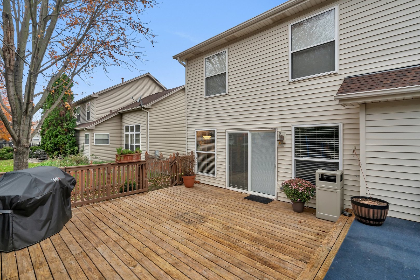 7312 Atkinson Circle Plainfield, IL 60586 - Photo 26 of 27 front view of a house with a barbeque