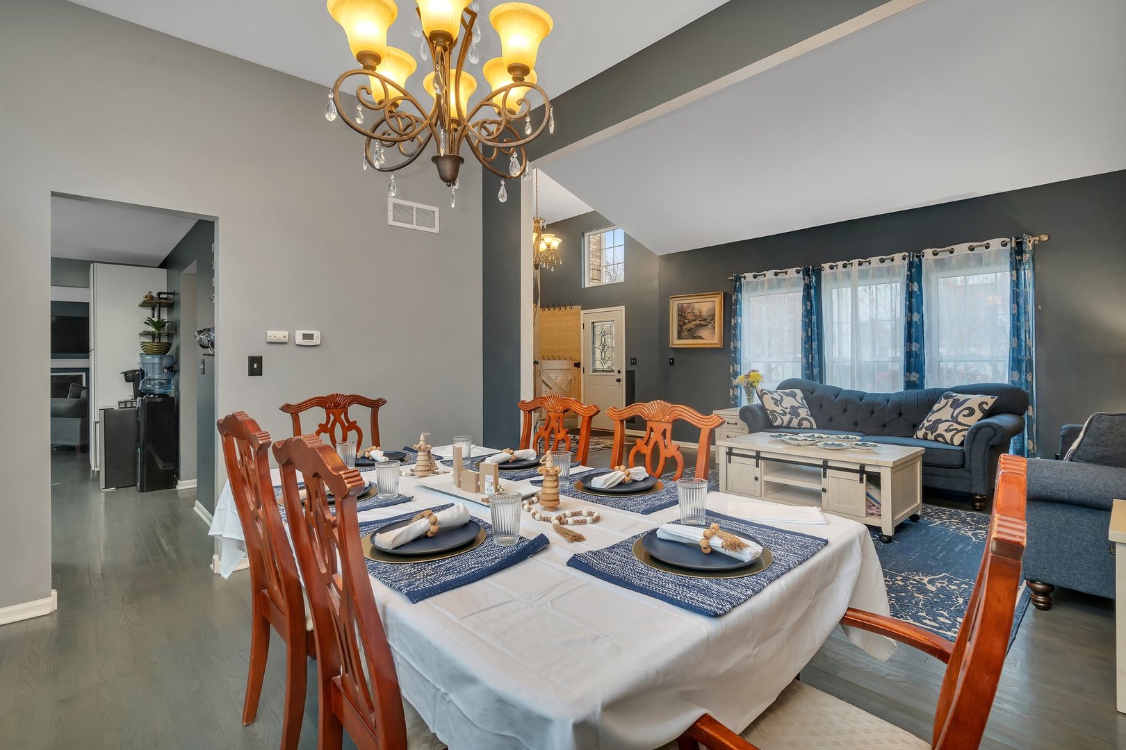 7312 Atkinson Circle Plainfield, IL 60586 - Photo 6 of 27 a living room with furniture a chandelier and a large window