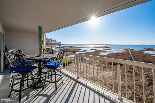 a terrace with a table and chairs