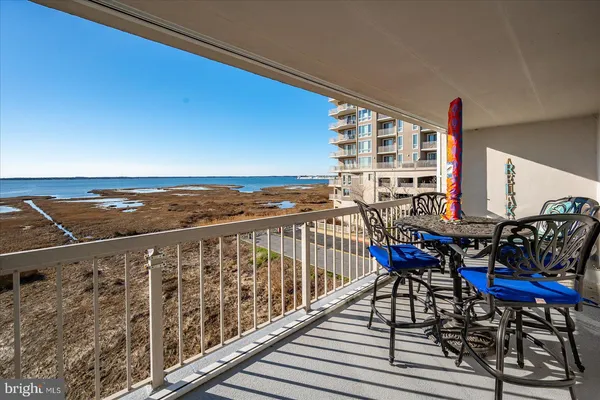 a view of balcony with furniture