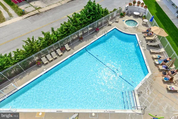 a view of swimming pool from a balcony