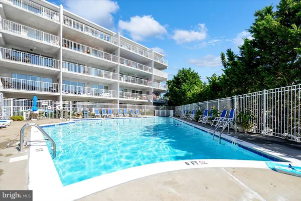 a view of a backyard with sitting area
