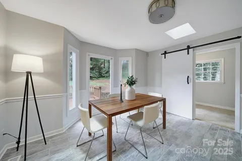 a view of a livingroom with furniture and wooden floor