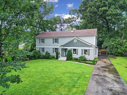a front view of a house with yard