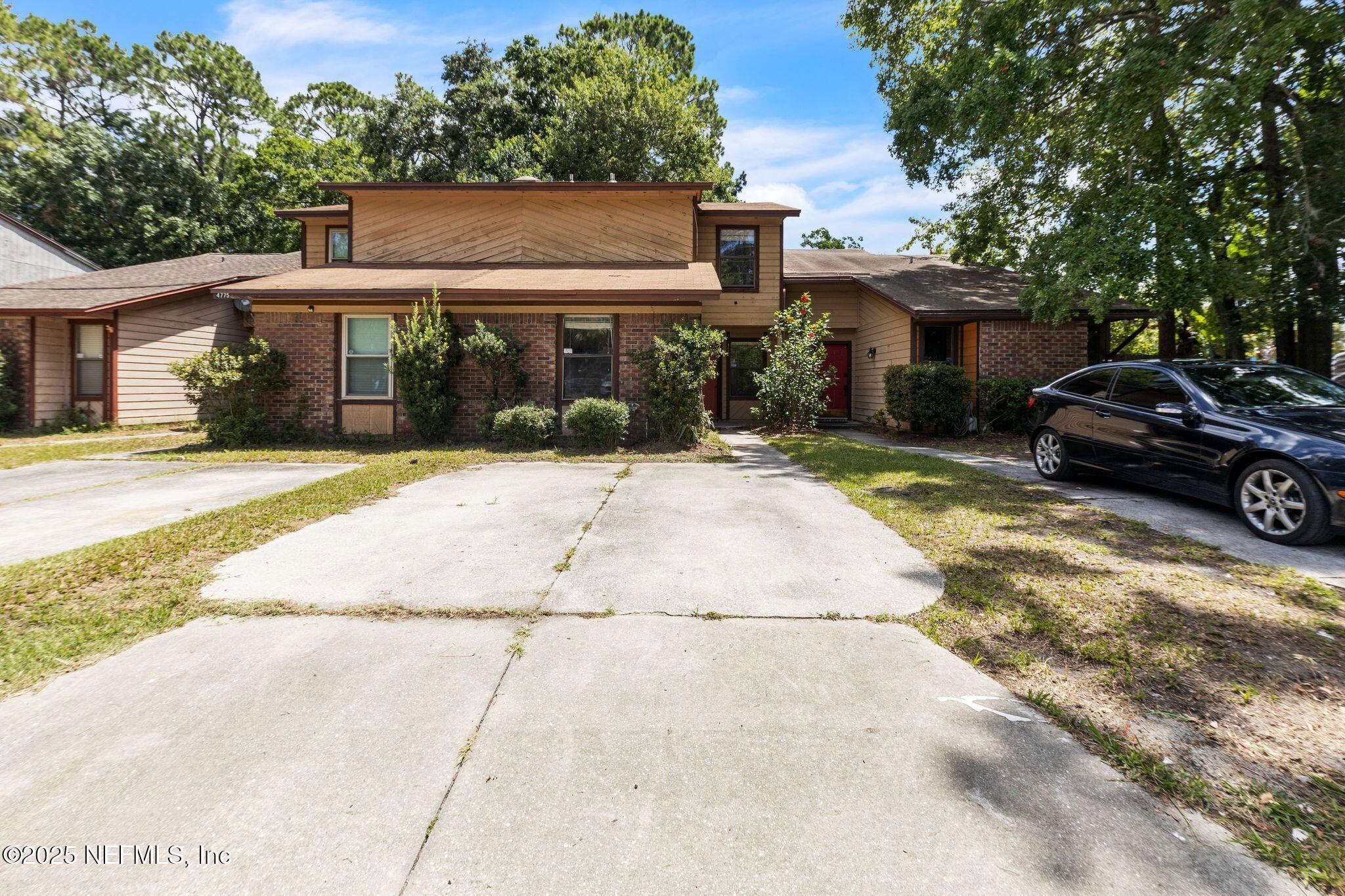 4777 Barnes Road South Jacksonville, FL 32207 - Photo 14 of 15 a view of a car parked in front of a brick house