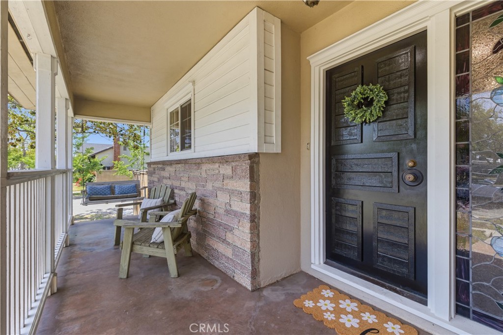 3327 North Studebaker Road Long Beach, CA 90808 - Photo 2 of 31 Great front porch with seating areas and a super cool front door