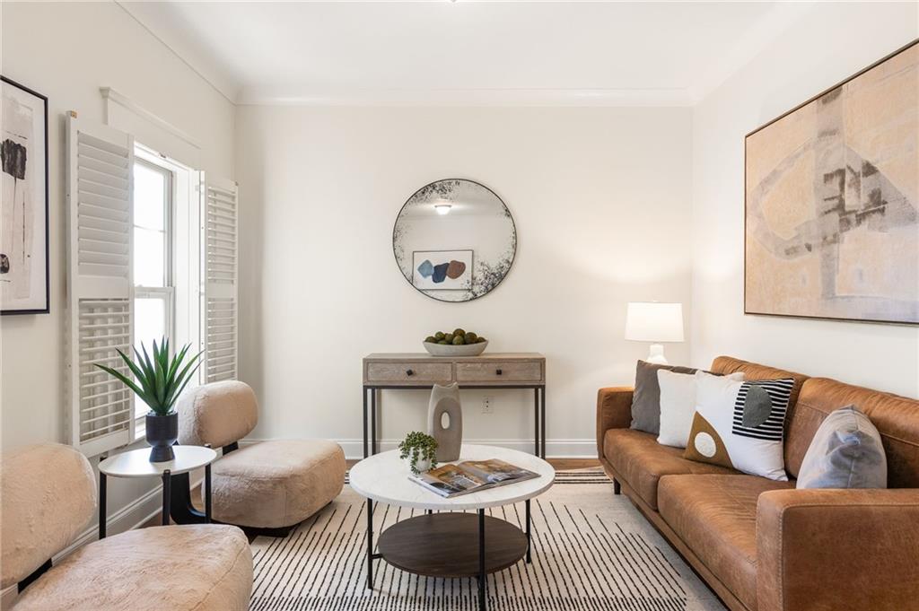 655 Mead Street Southeast, Unit 54 Atlanta, GA 30312 - Photo 11 of 25 a living room with furniture and a large window