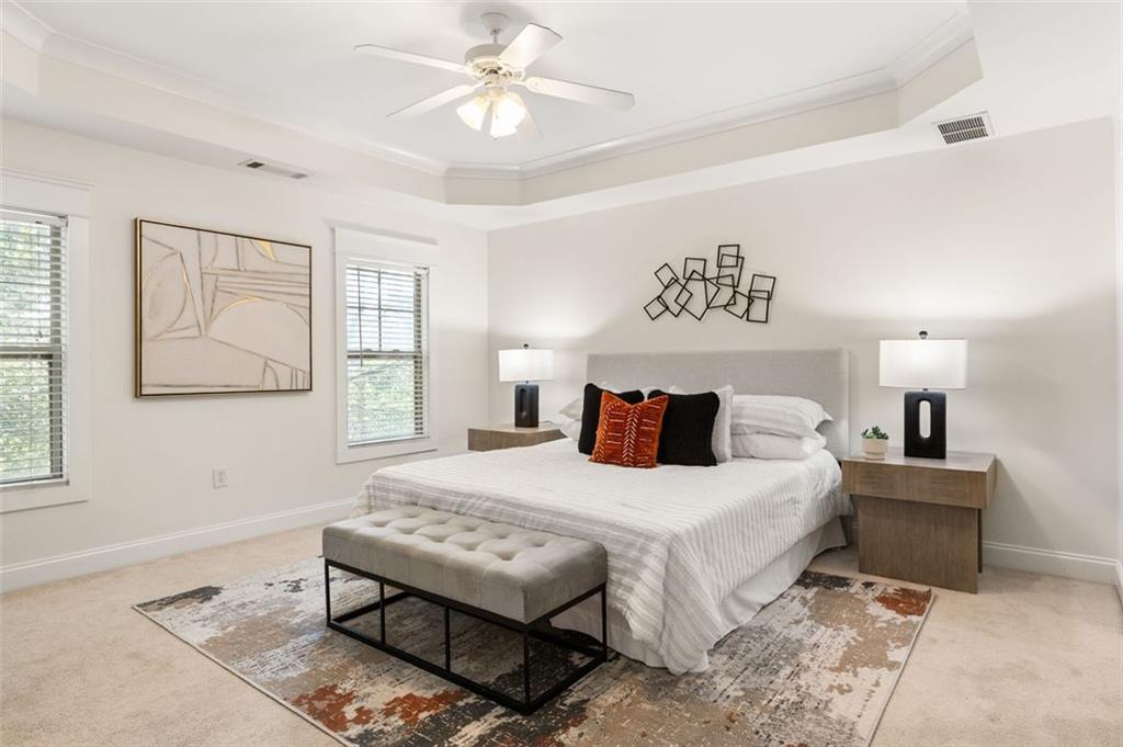 655 Mead Street Southeast, Unit 54 Atlanta, GA 30312 - Photo 14 of 25 a bedroom with a bed and a table in it with window