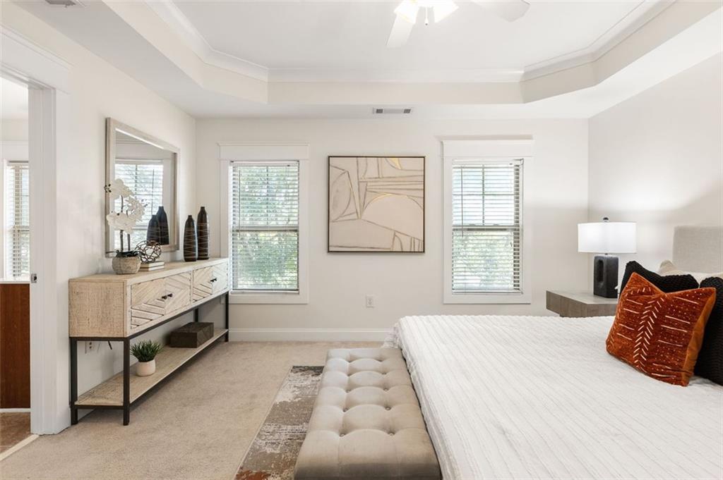 655 Mead Street Southeast, Unit 54 Atlanta, GA 30312 - Photo 16 of 25 a bedroom with a large bed and a window