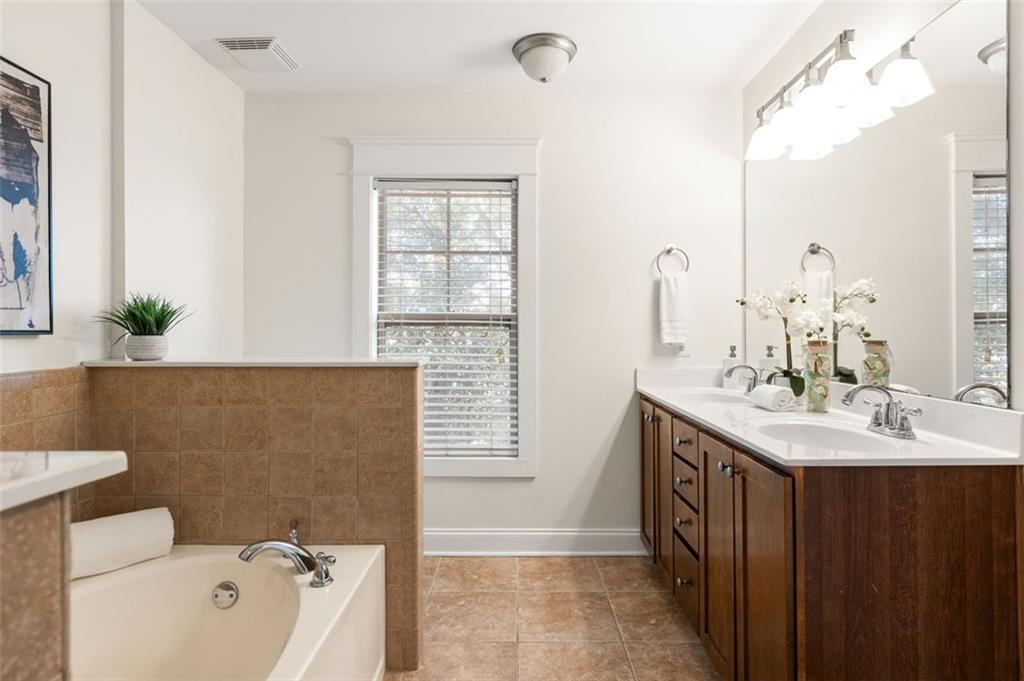 655 Mead Street Southeast, Unit 54 Atlanta, GA 30312 - Photo 17 of 25 a bathroom with a sink and a bathtub