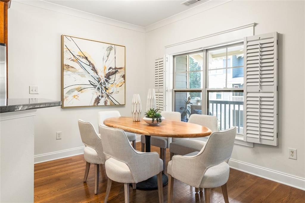 655 Mead Street Southeast, Unit 54 Atlanta, GA 30312 - Photo 4 of 25 a view of a dining room with furniture window and wooden floor